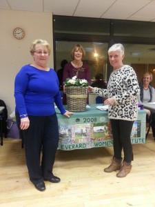 Collette Bradshaw and Gill Bywater making a presentation to Pat Martin, outgoing President